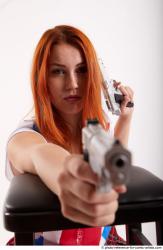 Woman Adult Average White Fighting with gun Kneeling poses Casual